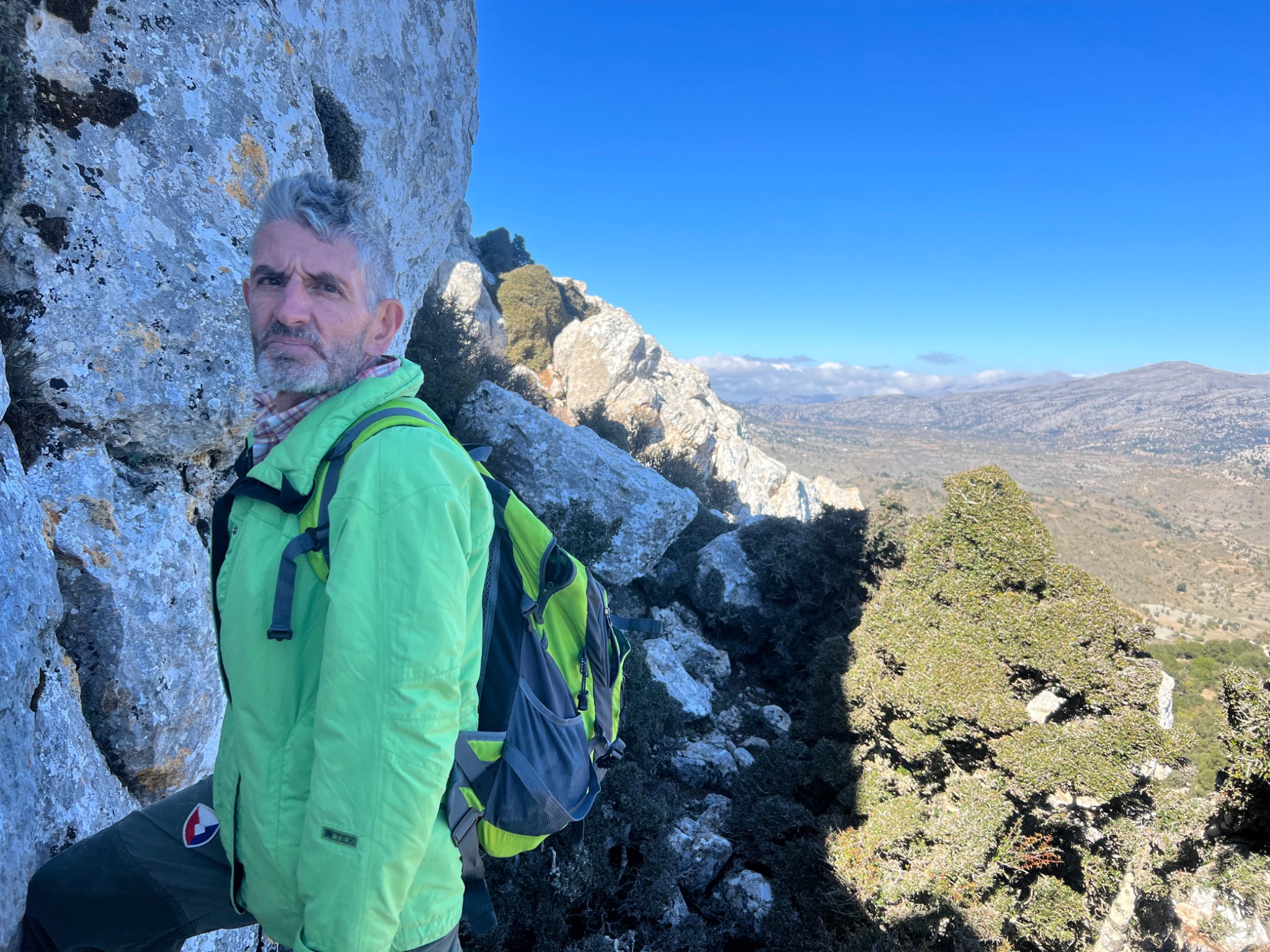 George Afordakos standing on a rocky mountain path